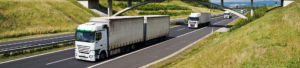 Multiple HGVs driving on motorway to promote Greenfield Risk Solutions Insurance Brokers - Motor Fleet Insurance