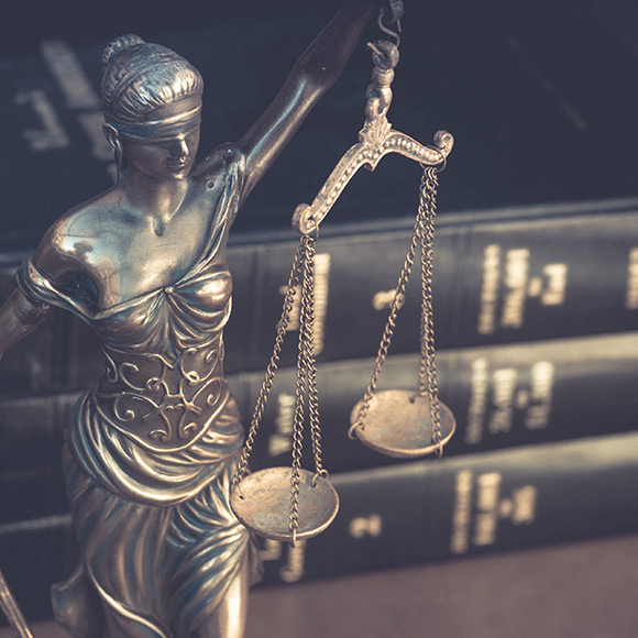 Banner_Products_Financial-Lines_Crime-Insurance Statue of lady justice holding scales to promote Greenfield Risk Solutions Insurance Brokers - Financial Lines - Crime Insurance