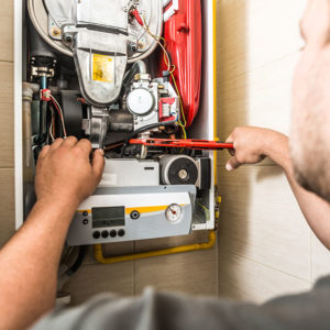 Engineer working on boiler to promote Greenfield Risk Solutions Insurance Brokers - High Risk and Complex Liability - Engineering Insurance