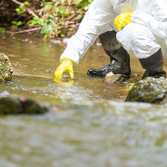 Banner_Products_High-Risk-Environment-Liability_04 Environmental specialist taking water sample from a local river to promote Greenfield Risk Solutions Insurance Brokers - High Risk Complex Liability - Liability
