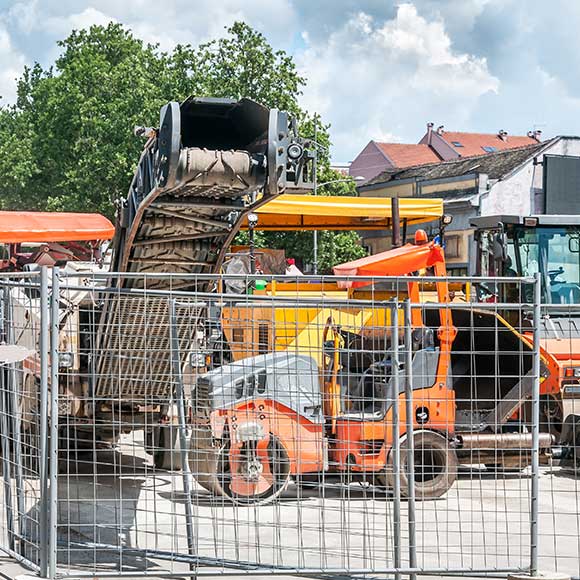 Banner_Products_Construction-Contractors_02-Contractors-Plant Fenced off construction equipment to promote Greenfield Risk Solutions Insurance Brokers - Contractors Insurance