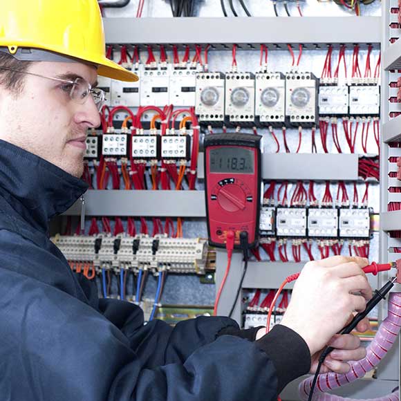 Banner_Products_Construction-Contractors_06-Electricians Electrician working on multiples meters to promote Greenfield Risk Solutions Insurance Brokers - Construction and Contractor Insurance - Electricians
